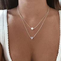 Conjunto de collar refinado con corazón y perla