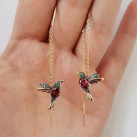 Pendientes de alambre con colibrí en dorado y cristales
